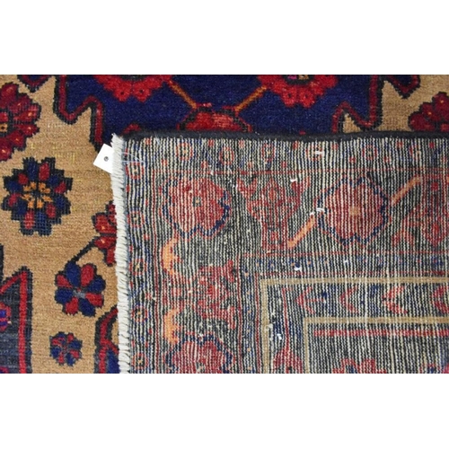 625 - A Persian Malayer rug, the camel ground centred by a medallion, 222 cm x 120 cm