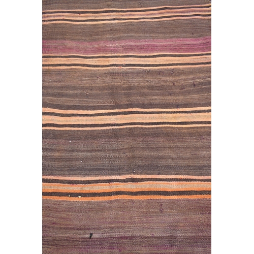 628 - A brown ground Azari kelim wide runner with repeating striped design, 420 x 95 cm (worn)