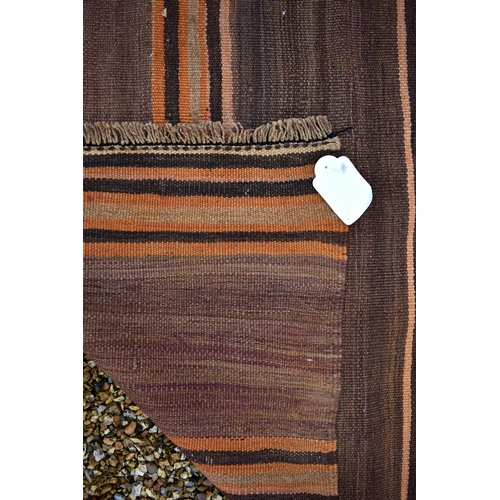 628 - A brown ground Azari kelim wide runner with repeating striped design, 420 x 95 cm (worn)