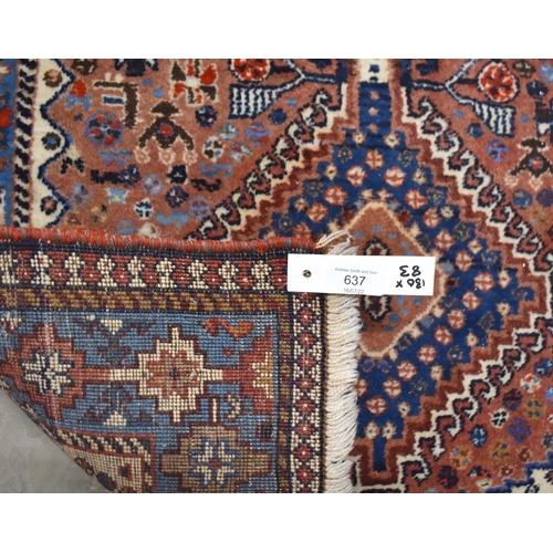 637 - Small Caucasian brick ground rug, diamond medallions, blue border, 130 x 83 cm