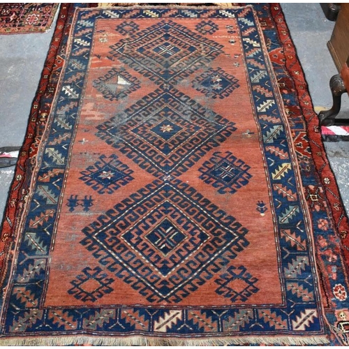 638 - A Persian Hamadan rug, the red ground with triple lozenges design, 115 cm x 198 cm