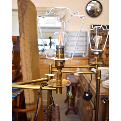 640 - A pair of 'Pooky Lighting Company' swing standard lamps, 148 cm high overall (2)