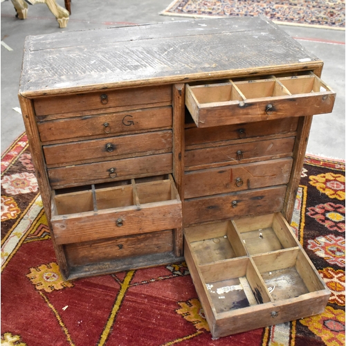 644 - An antique pine table top chest with graduating drawers (one missing), 58 cm wide x 32 cm deep x 50 ... 