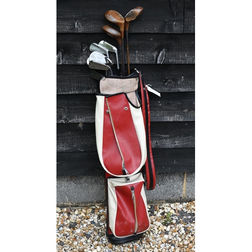 647 - Vintage leather Spalding golf bag to/w seven various irons and three woods, balls and leather clap h... 