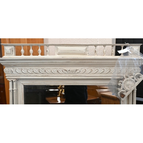 665 - A large French mirror with bevelled rectangular plate within cream painted frame with fluted columns... 