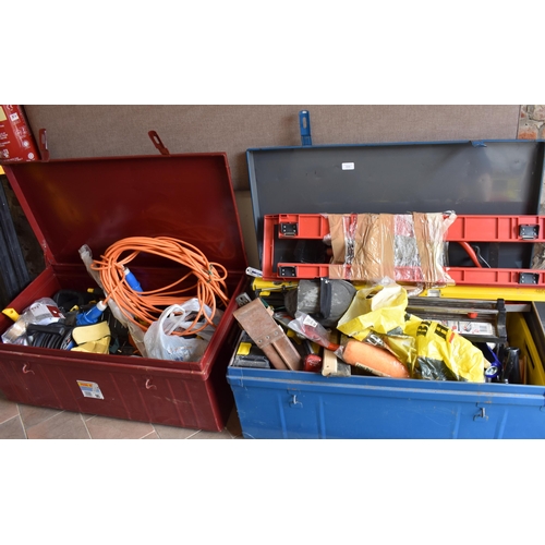 688 - Two metal tool trunks containing various DIY equipment, hand tools, lighting, extension cables, fixt... 