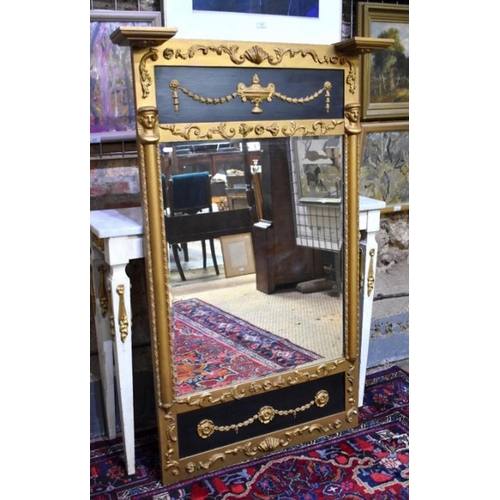 78 - A Edwardian Egyptian Revival giltwood and composite framed bevel edged mirror, 134 cm h x 86 cm w