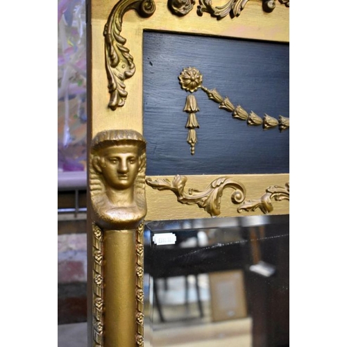 78 - A Edwardian Egyptian Revival giltwood and composite framed bevel edged mirror, 134 cm h x 86 cm w