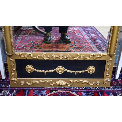 78 - A Edwardian Egyptian Revival giltwood and composite framed bevel edged mirror, 134 cm h x 86 cm w