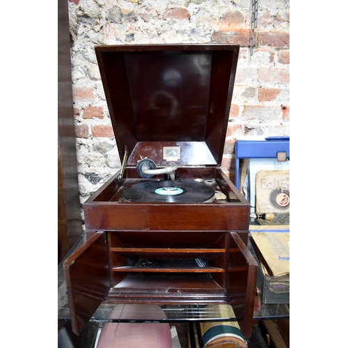 79 - A vintage oak cased HMV wind-up gramophone to/w and assortment of 78's and vinyl discs