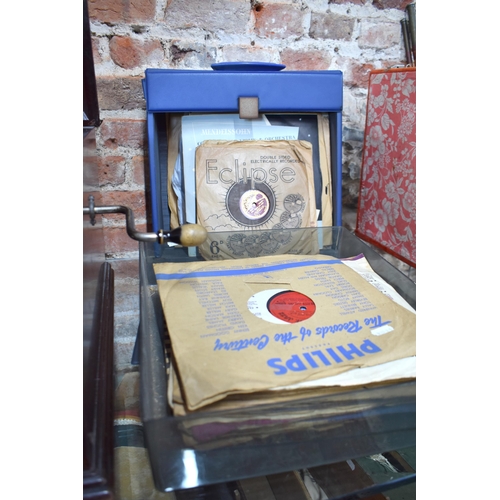 79 - A vintage oak cased HMV wind-up gramophone to/w and assortment of 78's and vinyl discs