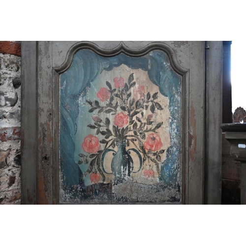 80 - A pair of 19th century continental painted pine hanging corner cabinets, the polychrome floral decor... 