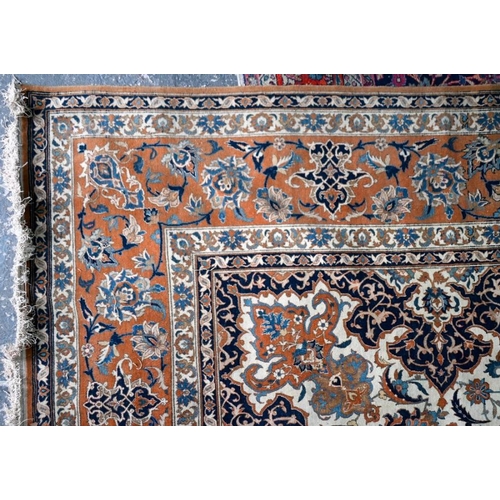 83 - A large and fine antique Persian Kashan carpet, centred by a medallion on camel ground with flowery ... 