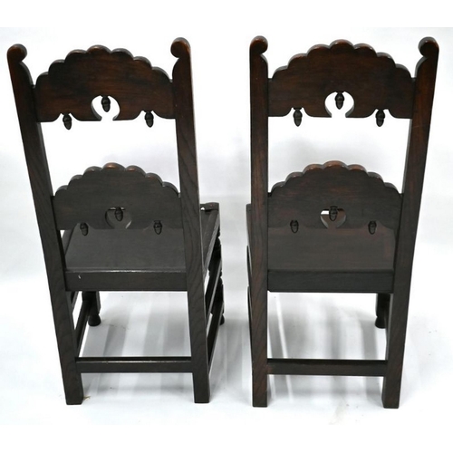 85 - A companion pair of carved oak chairs in the 17th century style, with plank seats (2)