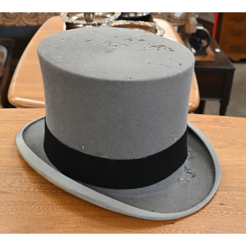 204 - Two antique leather top-hat boxes, each containing a black top hat to/w a grey 'Wedding' top hat by ... 