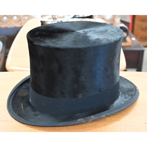 204 - Two antique leather top-hat boxes, each containing a black top hat to/w a grey 'Wedding' top hat by ... 