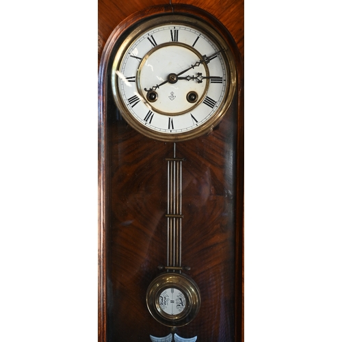 600 - Gustav Becker - a walnut cased German Vienna wall clock with foliate carved glazed case, enamelled b... 