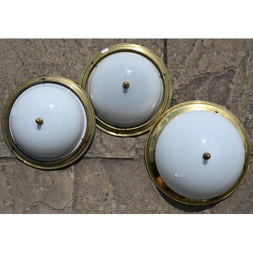 22 - A pair of circular brass ceiling lights with opaque glass shades to/w somewhat similar larger exampl... 