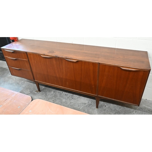24 - McIntosh Furniture - A mid century teak sideboard with central cupboards flanked by drawers and fall... 