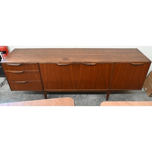 24 - McIntosh Furniture - A mid century teak sideboard with central cupboards flanked by drawers and fall... 
