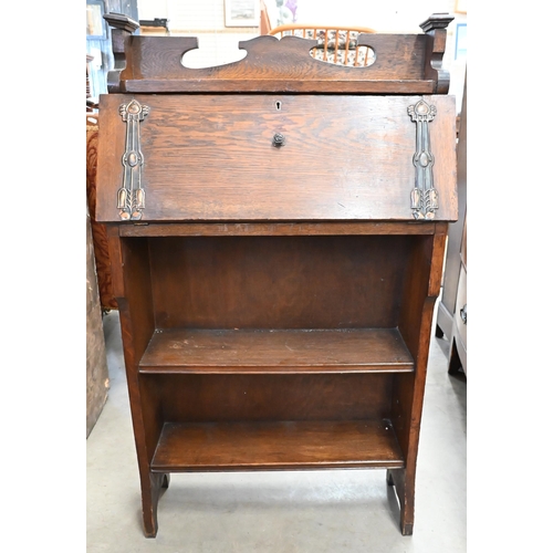 34 - An early 20th century Arts & Crafts oak and metal mounted shallow bureau in the Liberty style, 64 x ... 