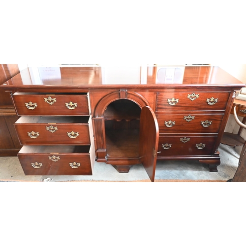 37 - A George III style mahogany sideboard with central arched cupboard and three drawers to each side wi... 