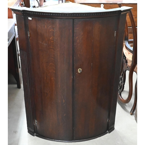 38 - A 19th century oak hanging corner cupboard with two doors, 100 cm high
