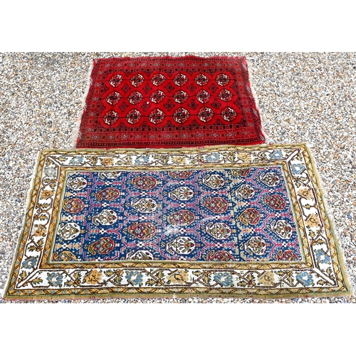 508 - A blue-ground Boteh rug 207cm x 110 cm to/with a red Turkoman rug 146 cm x 112 cm (2)