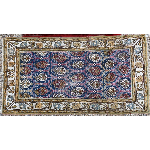 508 - A blue-ground Boteh rug 207cm x 110 cm to/with a red Turkoman rug 146 cm x 112 cm (2)