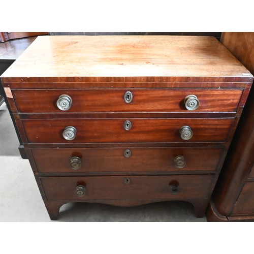 519 - A 19th century mahogany chest of four long graduating drawers with floral brass handles, 84 cm wide ... 