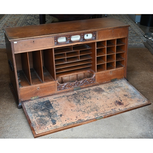 521 - An early 20th century mahogany bureau cabinet with fall-front panel enclosing fitted interior below ... 