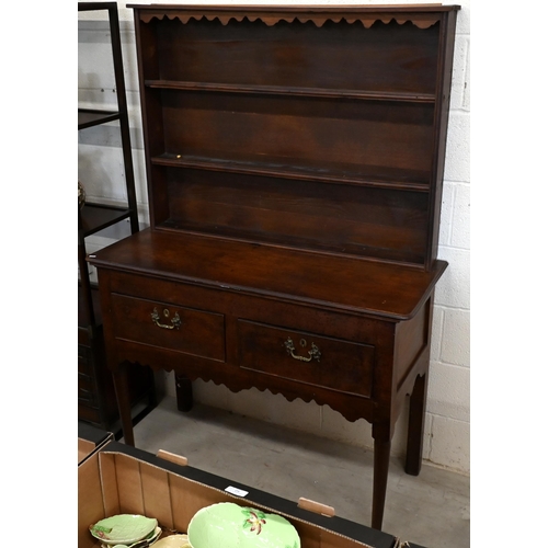 522 - A small Georgian and later oak dresser with two shelf plate rack on base with two drawers and turned... 