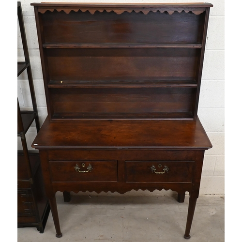 522 - A small Georgian and later oak dresser with two shelf plate rack on base with two drawers and turned... 