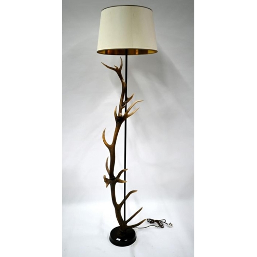 47 - The Original Bookworks Ltd, an antler mounted standard lamp mounted on a circular wooden base, appro... 