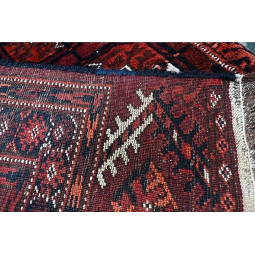 500 - An old Turkman Tekke rug, the red-brown ground with geometric guls, 218 x 120 cm