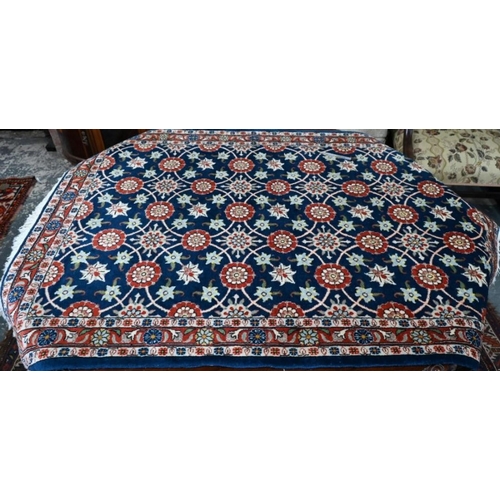 502 - Persian Veremin rug with floral design on a blue ground, 150 x 106 cm