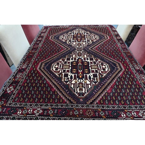 512 - A Persian Bidjar twin lozenge boteh design on red-brown ground rug, 187 x 133 cm