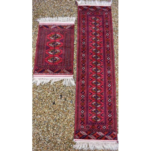 514 - An Afghan Turkman runner, red ground 200 cm x 52 cm to/w a small rug of conforming design, 92 cm x 6... 