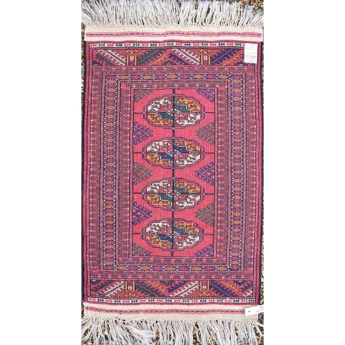 514 - An Afghan Turkman runner, red ground 200 cm x 52 cm to/w a small rug of conforming design, 92 cm x 6... 