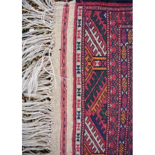 514 - An Afghan Turkman runner, red ground 200 cm x 52 cm to/w a small rug of conforming design, 92 cm x 6... 