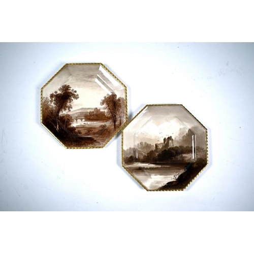 76 - A pair of Victorian Copeland pottery octagonal plates, sepia-painted with Brougham Castle and Norham... 