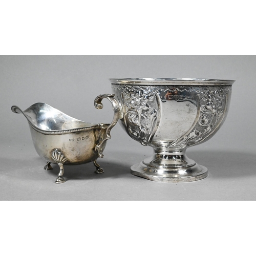 100 - An Edwardian silver rose-bowl with floral embossed decoration, on stemmed foot, Walker & Hall, C... 