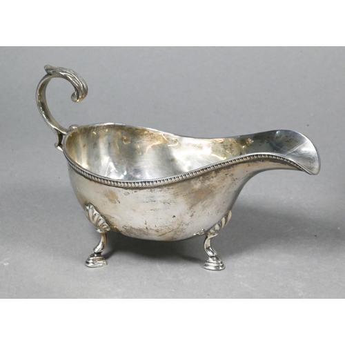 100 - An Edwardian silver rose-bowl with floral embossed decoration, on stemmed foot, Walker & Hall, C... 