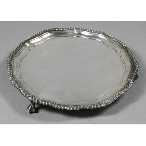 105 - A late Victorian Scottish silver letter salver with gadrooned rim and three claw and ball feet, Hami... 