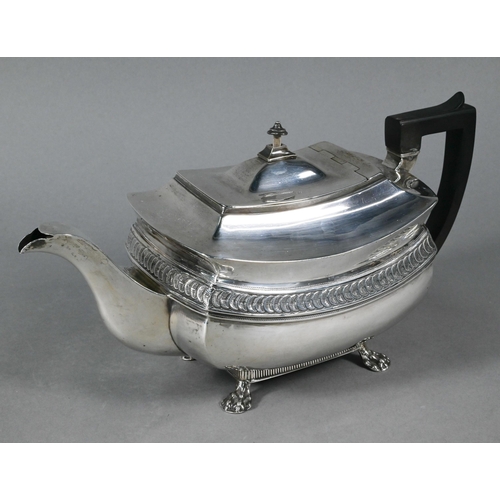 109 - A George III silver teapot with overlapping 'orange segment' lunette frieze, composite handle, on pa... 