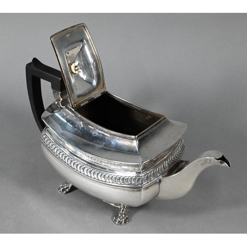 109 - A George III silver teapot with overlapping 'orange segment' lunette frieze, composite handle, on pa... 