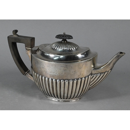 110 - An oval silver half-reeded bracket teapot with composite finial and handle, William Hutton & Son... 