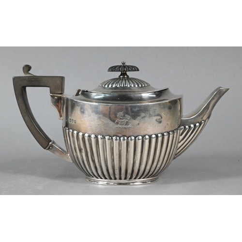 110 - An oval silver half-reeded bracket teapot with composite finial and handle, William Hutton & Son... 