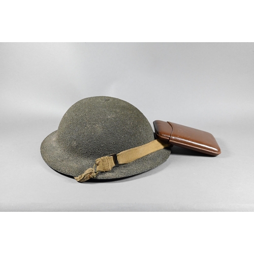 1114A - A World War II pattern British army helmet with textured finish, to/w a leather cigar-case (2)