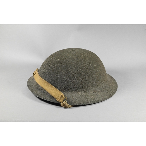 1114A - A World War II pattern British army helmet with textured finish, to/w a leather cigar-case (2)